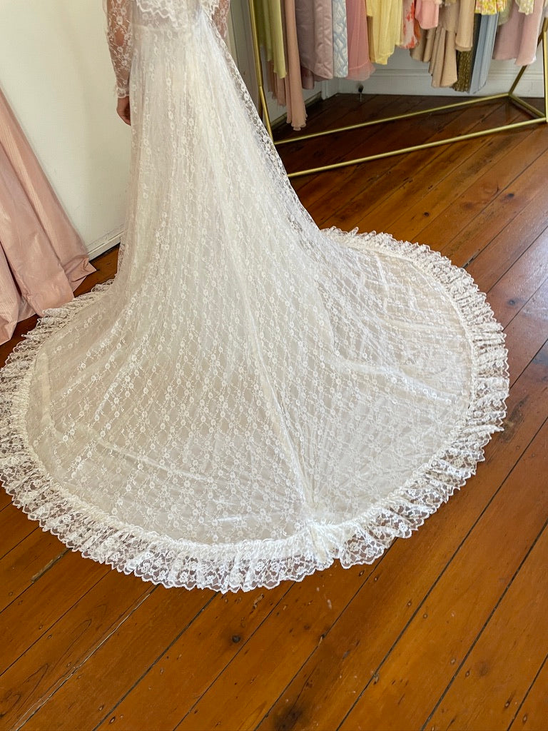 Vintage 80s dramatic lace long sleeve wedding gown with train