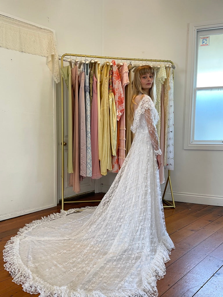 Vintage 80s dramatic lace long sleeve wedding gown with train