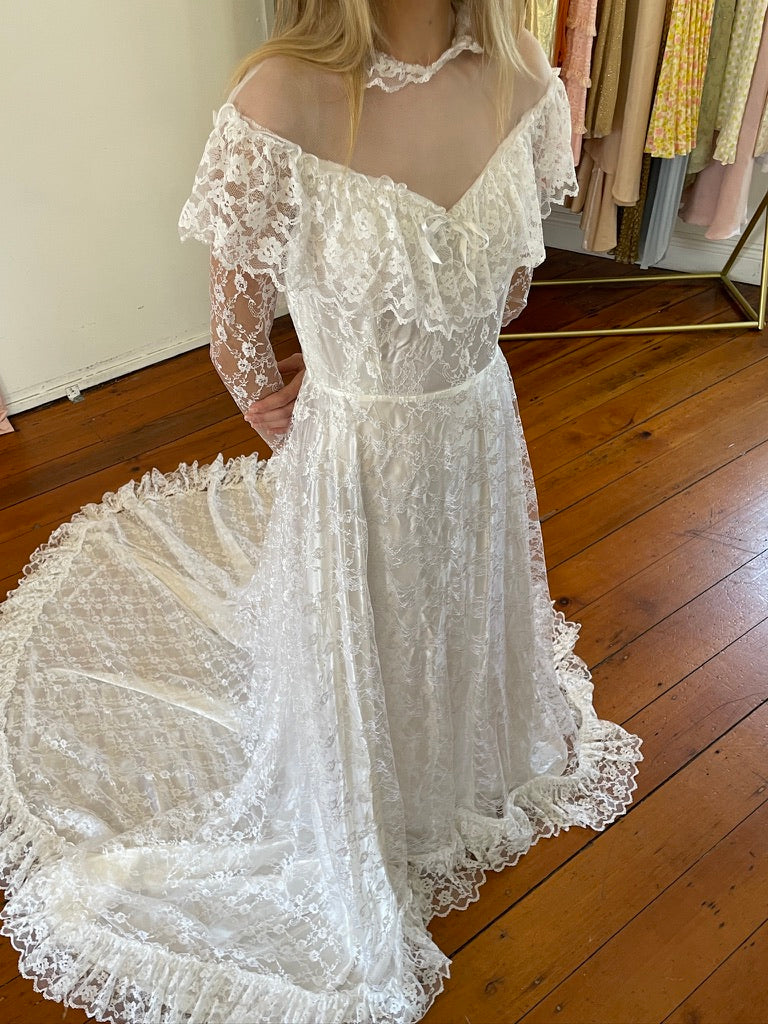 Vintage 80s dramatic lace long sleeve wedding gown with train
