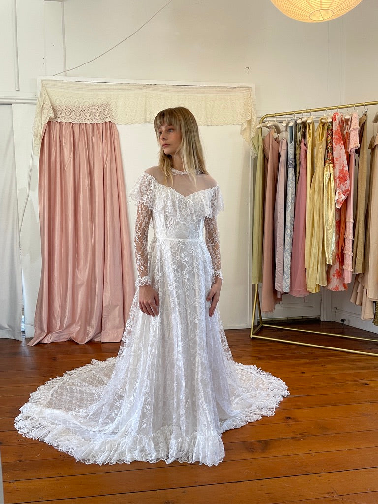 Vintage 80s dramatic lace long sleeve wedding gown with train
