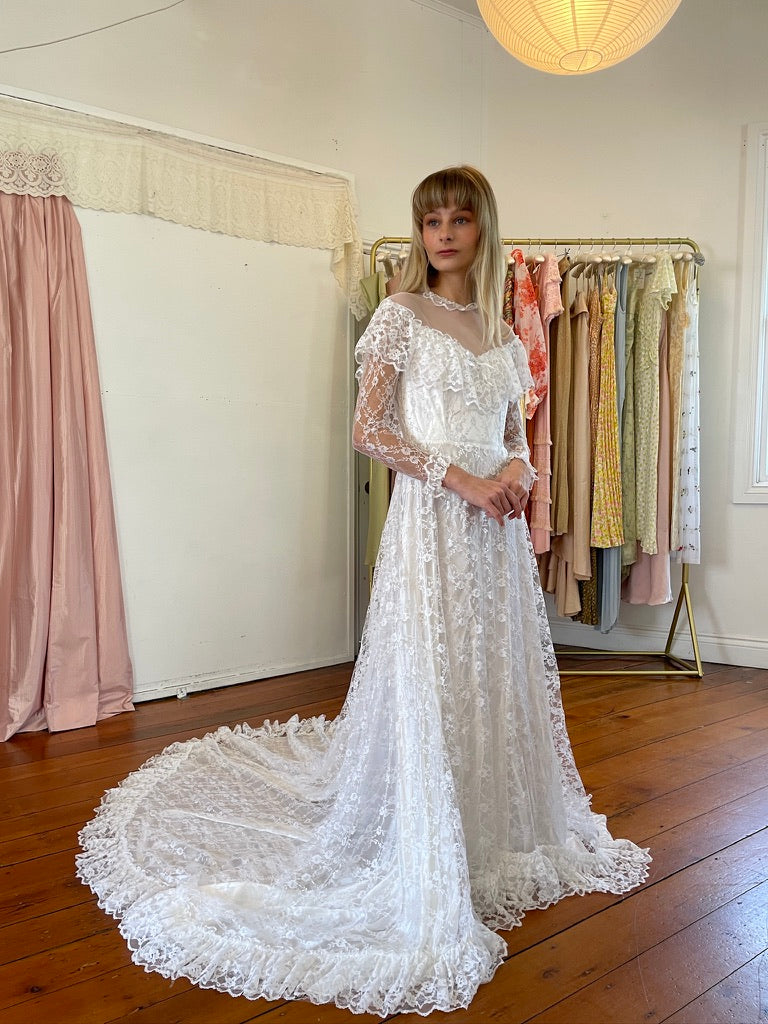 Vintage 80s dramatic lace long sleeve wedding gown with train