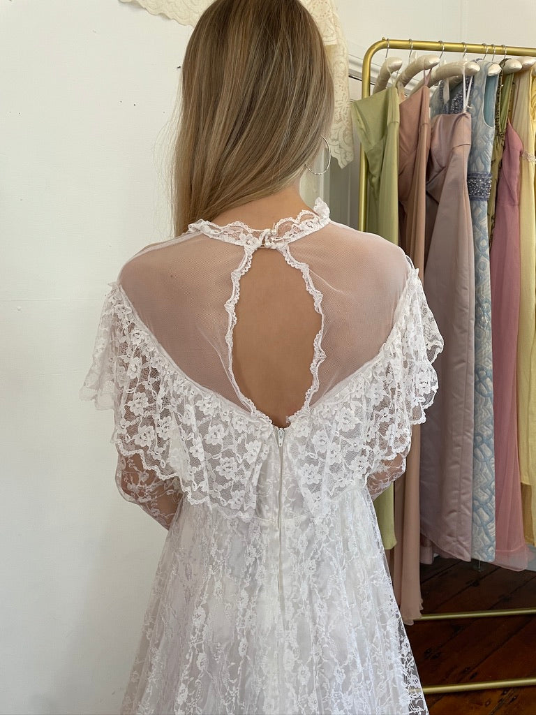 Vintage 80s dramatic lace long sleeve wedding gown with train