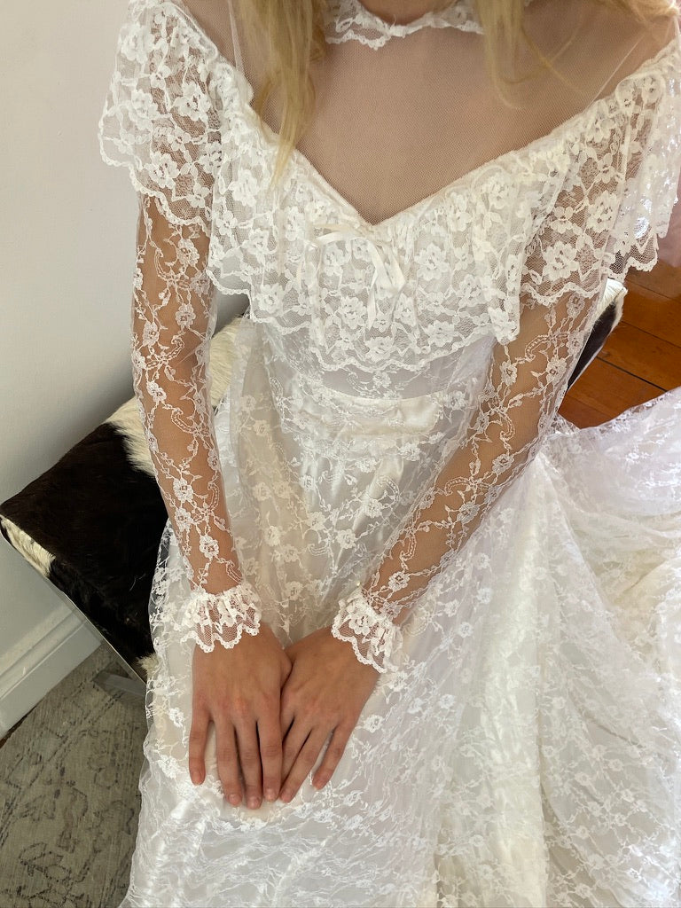 Vintage 80s dramatic lace long sleeve wedding gown with train