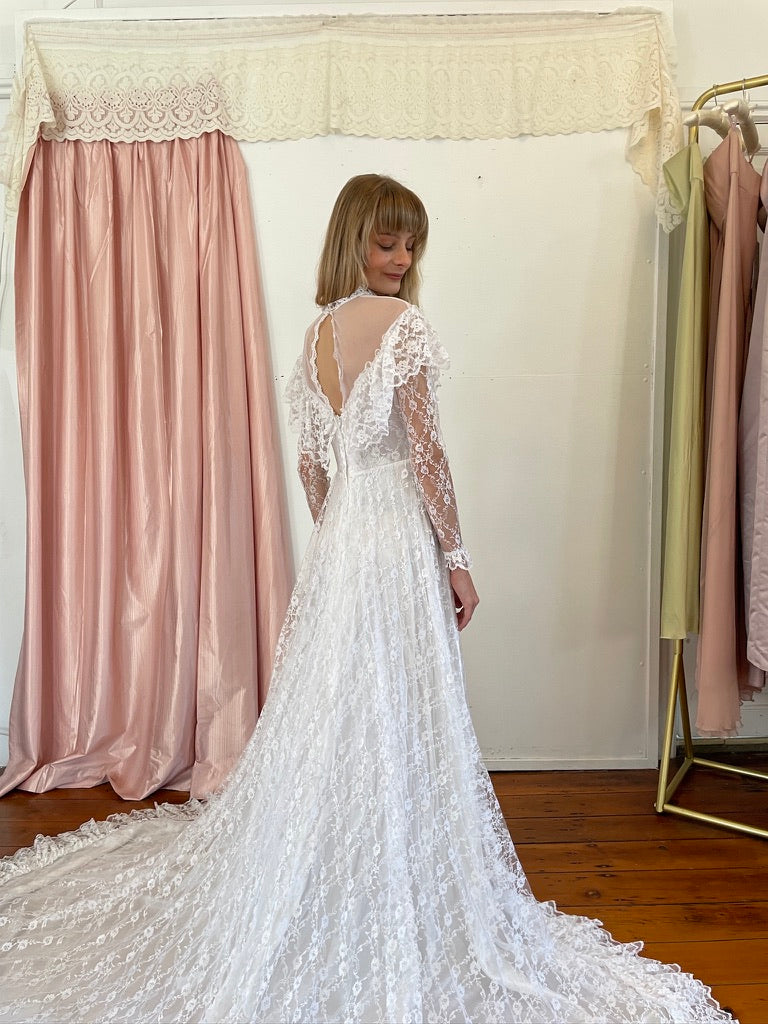 Vintage 80s dramatic lace long sleeve wedding gown with train