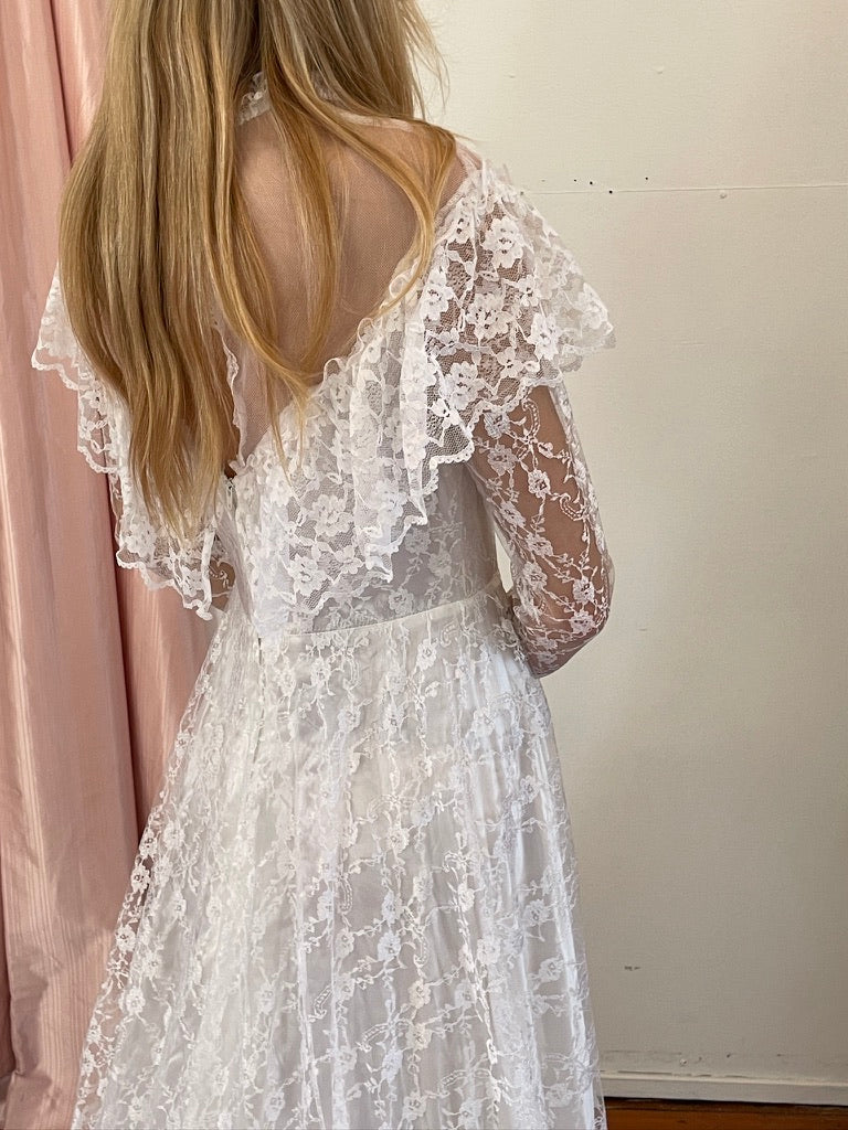Vintage 80s dramatic lace long sleeve wedding gown with train