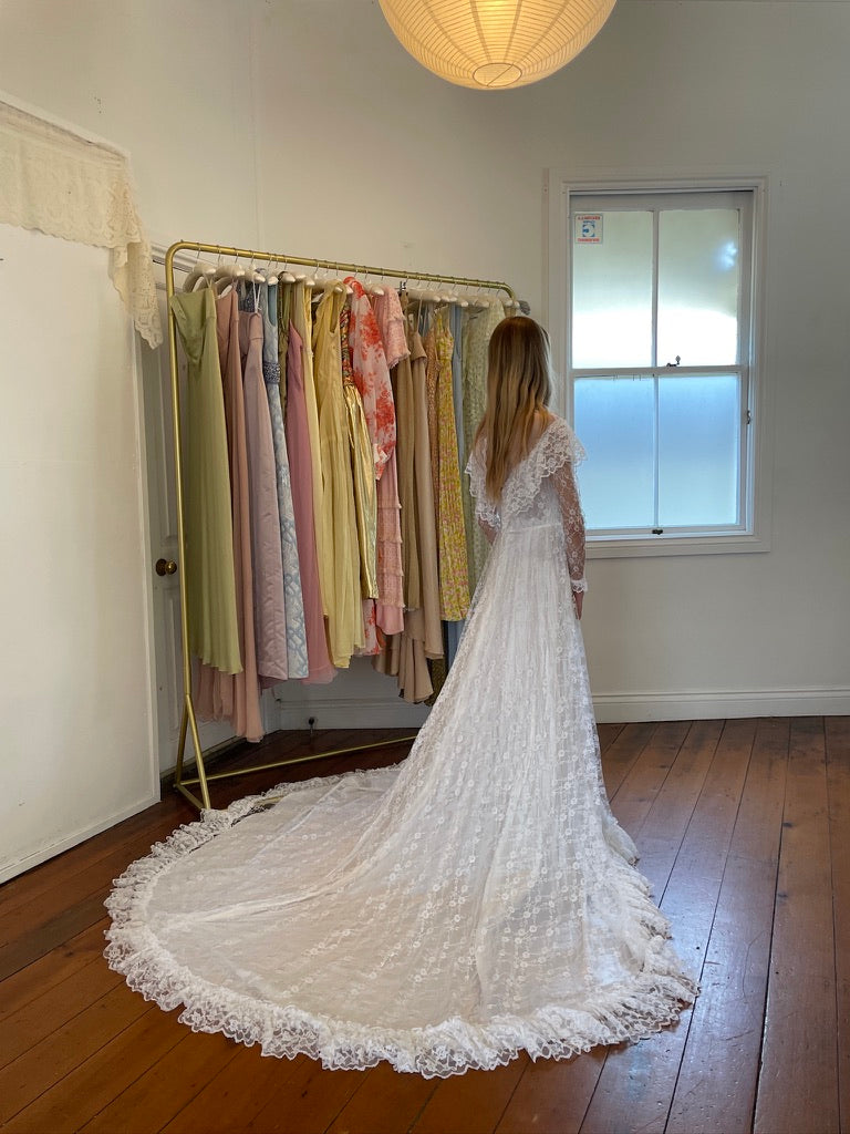 Vintage 80s dramatic lace long sleeve wedding gown with train
